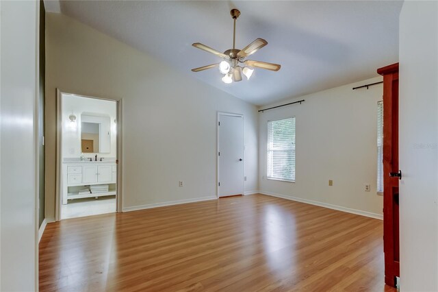 17631 Grove View Dr, Lutz, FL 33549 - unfurnished room featuring lofted ceiling, ceiling fan, and light wood finished floors