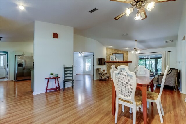 17631 Grove View Dr, Lutz, FL 33549 - dining area with ceiling fan, vaulted ceiling, and light wood-style floors