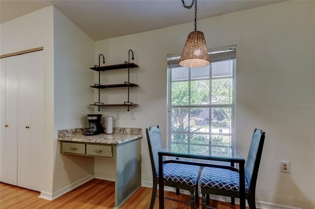 17631 Grove View Dr, Lutz, FL 33549 - dining area with light wood-style flooring and baseboards