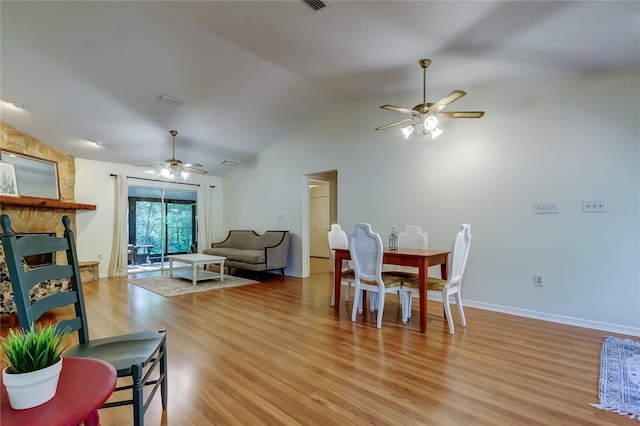 17631 Grove View Dr, Lutz, FL 33549 - dining room featuring a ceiling fan, lofted ceiling, and light wood-style flooring