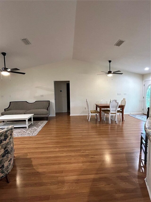17631 Grove View Dr, Lutz, FL 33549 - living area featuring a ceiling fan, wood finished floors, and vaulted ceiling