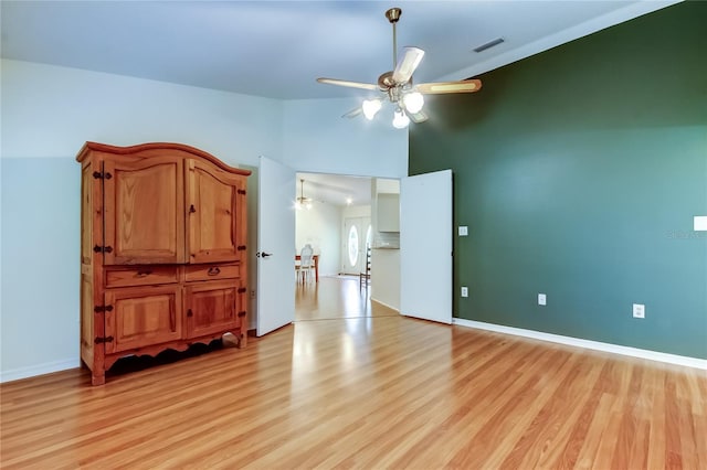 17631 Grove View Dr, Lutz, FL 33549 - unfurnished bedroom featuring light wood finished floors and high vaulted ceiling