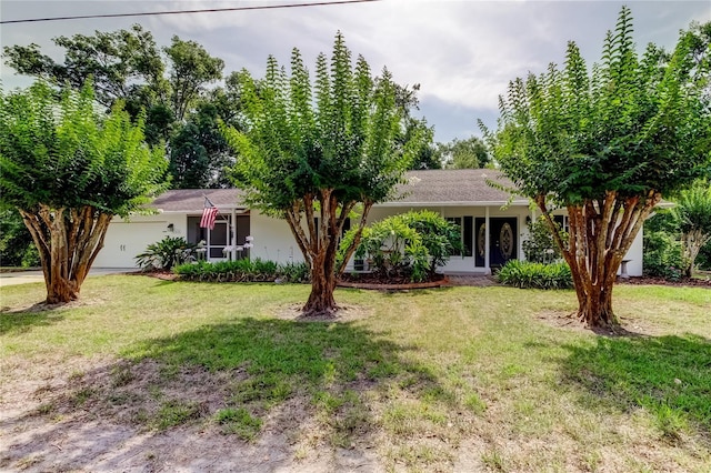 17631 Grove View Dr, Lutz, FL 33549 - ranch-style home with a front lawn, stucco siding, and a garage