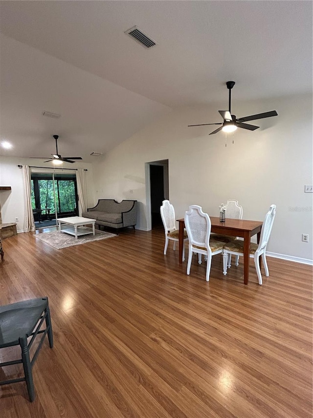 17631 Grove View Dr, Lutz, FL 33549 - dining area with a ceiling fan, wood finished floors, and lofted ceiling