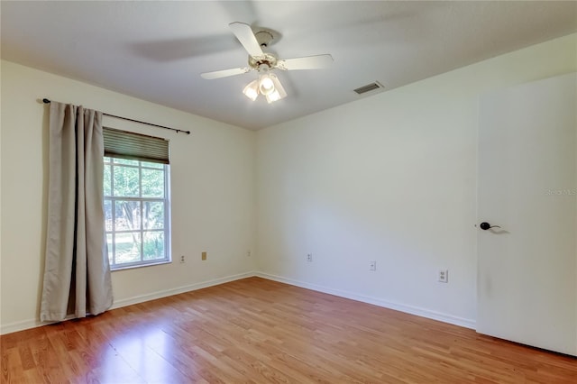 17631 Grove View Dr, Lutz, FL 33549 - empty room with light wood-style floors and ceiling fan