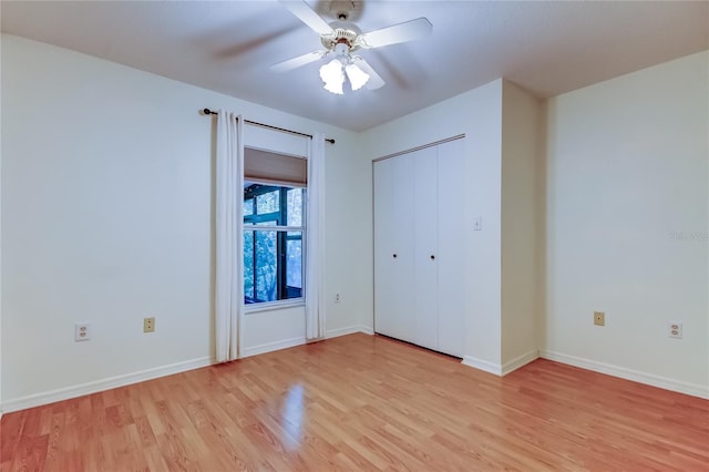 17631 Grove View Dr, Lutz, FL 33549 - unfurnished bedroom featuring light wood finished floors and a ceiling fan