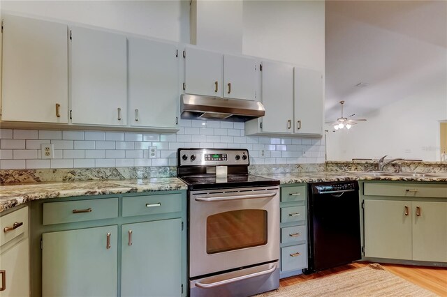 17631 Grove View Dr, Lutz, FL 33549 - kitchen with black dishwasher, stainless steel electric range, under cabinet range hood, ceiling fan, and decorative backsplash