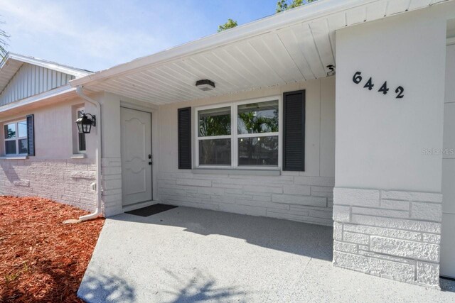 6442 Sutherland Ave, New Port Richey, FL 34653 - property entrance featuring stone siding