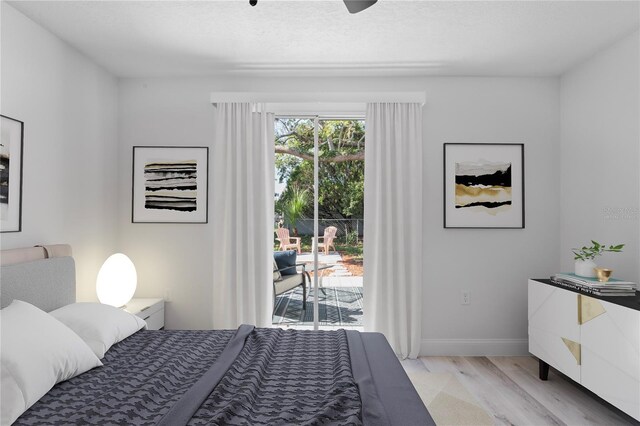 6442 Sutherland Ave, New Port Richey, FL 34653 - bedroom with access to outside and light wood finished floors