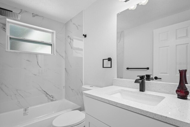 6442 Sutherland Ave, New Port Richey, FL 34653 - bathroom with vanity and shower / washtub combination