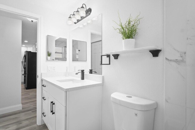 6442 Sutherland Ave, New Port Richey, FL 34653 - bathroom with vanity and wood finished floors