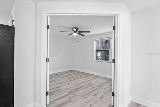 6442 Sutherland Ave, New Port Richey, FL 34653 - empty room with a ceiling fan and light wood-style flooring