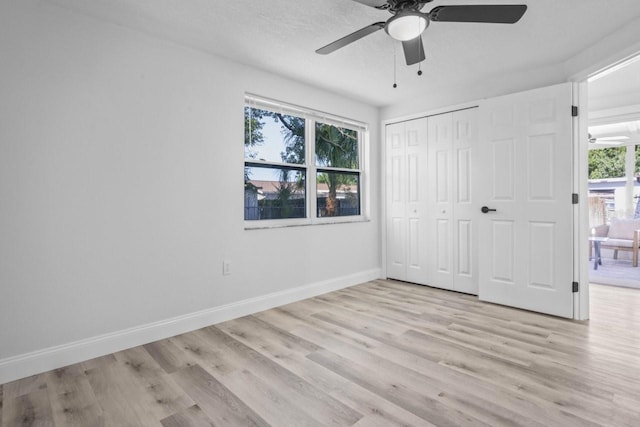 6442 Sutherland Ave, New Port Richey, FL 34653 - unfurnished bedroom featuring light wood-style floors, a closet, and a ceiling fan
