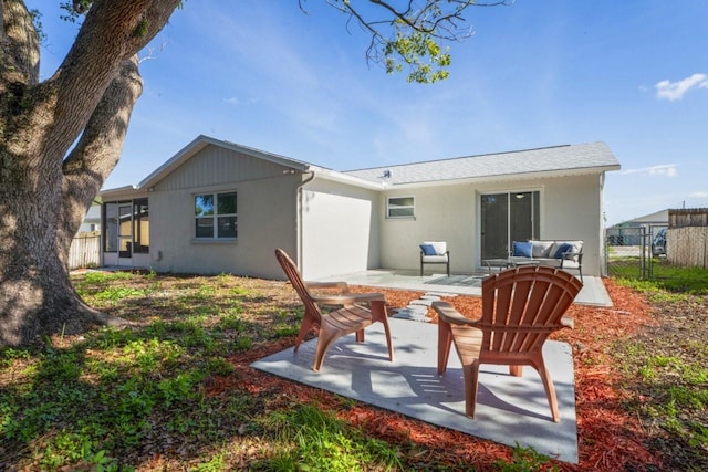 6442 Sutherland Ave, New Port Richey, FL 34653 - rear view of property featuring a patio area and stucco siding