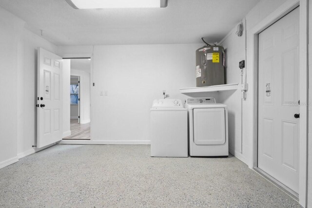 6442 Sutherland Ave, New Port Richey, FL 34653 - laundry room featuring washer and clothes dryer and electric water heater
