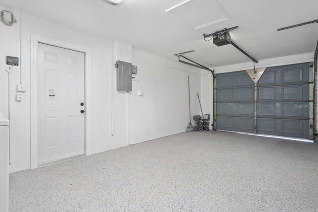 6442 Sutherland Ave, New Port Richey, FL 34653 - garage with electric panel and a garage door opener