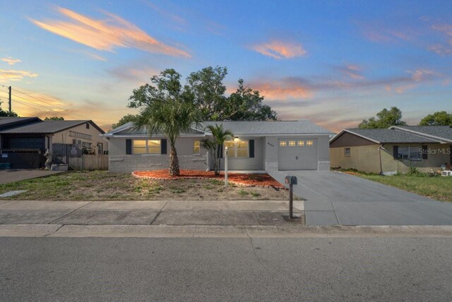 6442 Sutherland Ave, New Port Richey, FL 34653 - ranch-style home featuring an attached garage and driveway