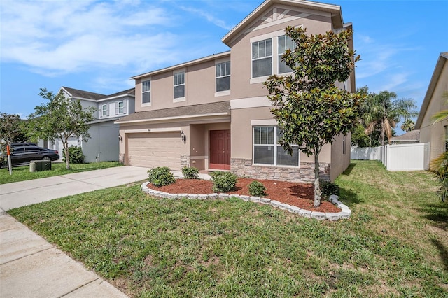 7641 Armonk Ln, Wesley Chapel, FL 33545 - view of front of home with stucco siding, concrete driveway, a garage, and stone siding