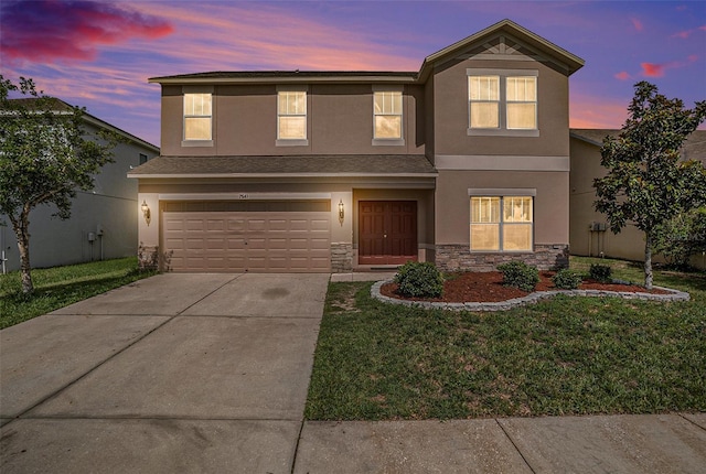 7641 Armonk Ln, Wesley Chapel, FL 33545 - traditional-style home featuring stucco siding, stone siding, concrete driveway, an attached garage, and a front yard