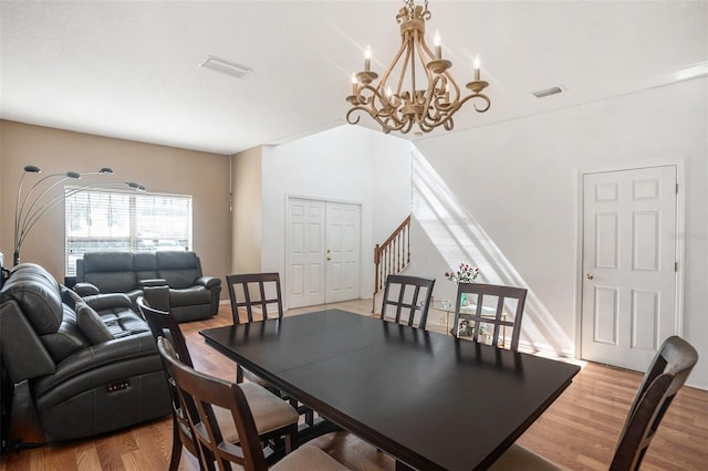 7641 Armonk Ln, Wesley Chapel, FL 33545 - dining area with a chandelier and light wood-type flooring