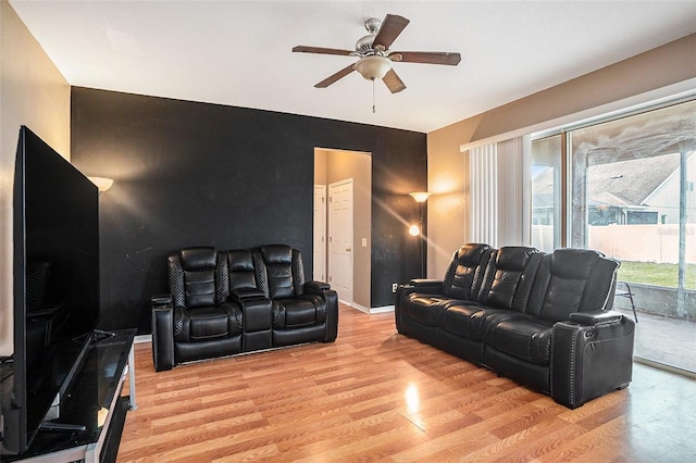 7641 Armonk Ln, Wesley Chapel, FL 33545 - living area featuring a ceiling fan, light wood-type flooring, and an accent wall