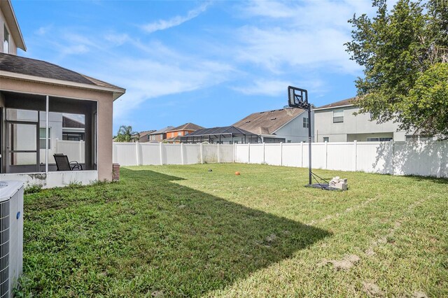 7641 Armonk Ln, Wesley Chapel, FL 33545 - view of yard featuring a sunroom and a residential view