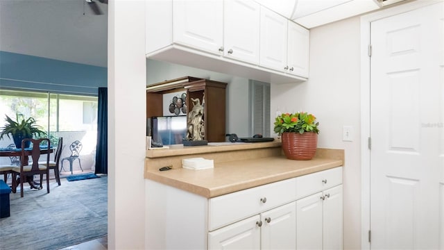 1851 Bough Ave Unit A, Clearwater, FL 33760 - kitchen with white cabinetry and light countertops