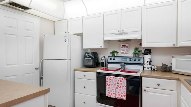 1851 Bough Ave Unit A, Clearwater, FL 33760 - kitchen with under cabinet range hood, white appliances, white cabinets, and light countertops