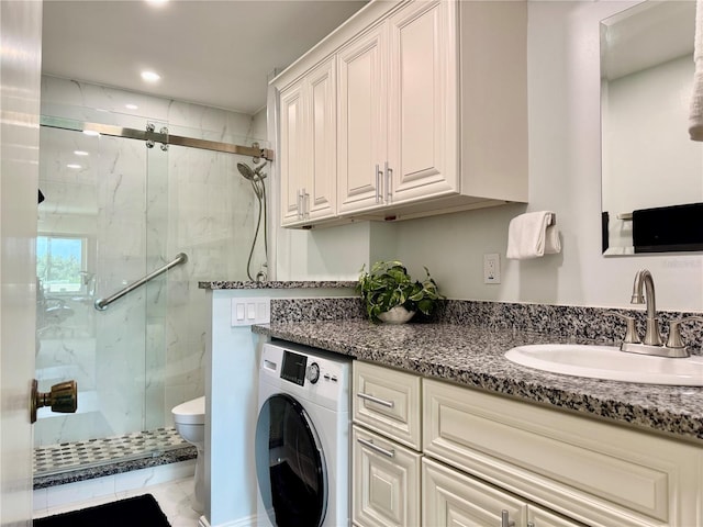 100 Bluff View Dr Unit 114C, Belleair Bluffs, FL 33770 - bathroom featuring washer / clothes dryer, a marble finish shower, vanity, and recessed lighting