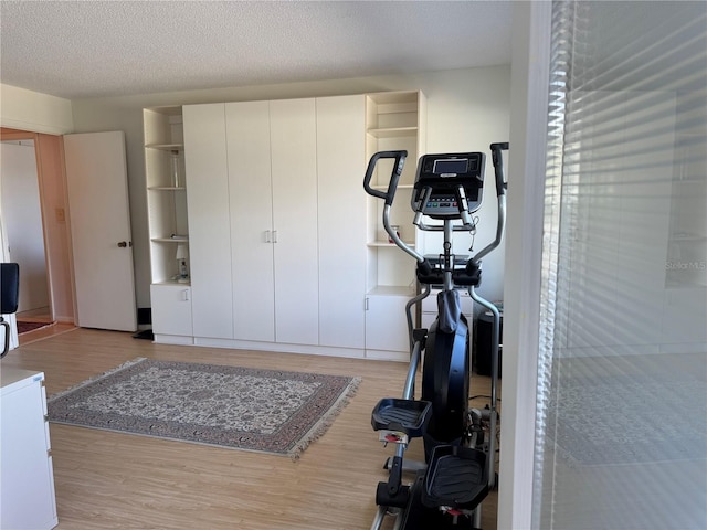 100 Bluff View Dr Unit 114C, Belleair Bluffs, FL 33770 - exercise room featuring wood finished floors