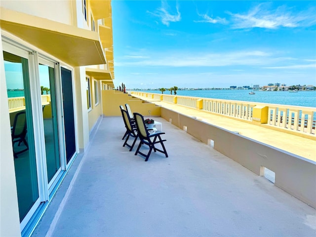 100 Bluff View Dr Unit 114C, Belleair Bluffs, FL 33770 - view of patio featuring a water view