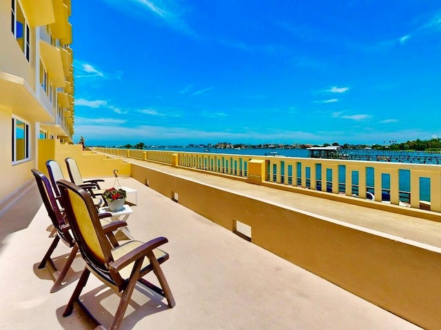 100 Bluff View Dr Unit 114C, Belleair Bluffs, FL 33770 - view of patio / terrace featuring a water view