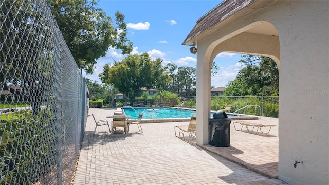 2941 Lichen Ln Unit B, Clearwater, FL 33760 - community pool featuring a patio
