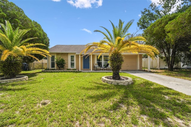 3628 Dellefield St, New Port Richey, FL 34655 - view of front facade featuring a garage, driveway, and stucco siding