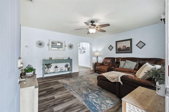 3628 Dellefield St, New Port Richey, FL 34655 - living room featuring ceiling fan, arched walkways, wood finished floors, and baseboards
