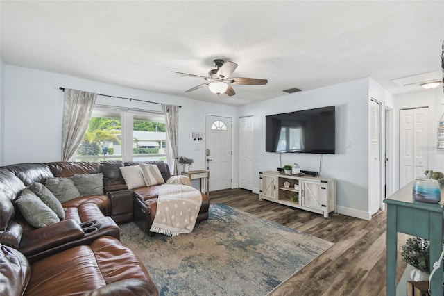 3628 Dellefield St, New Port Richey, FL 34655 - living area with ceiling fan, wood finished floors, and baseboards