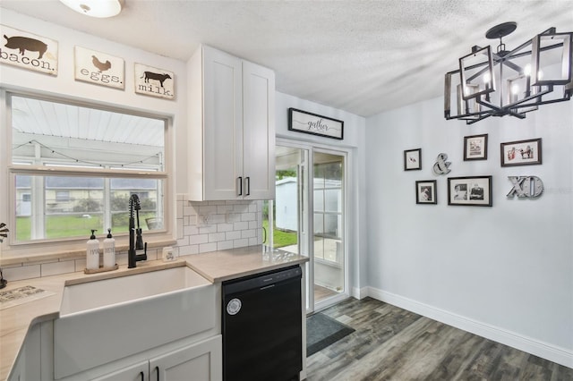 3628 Dellefield St, New Port Richey, FL 34655 - kitchen with dishwasher, a sink, tasteful backsplash, baseboards, and dark wood-style flooring