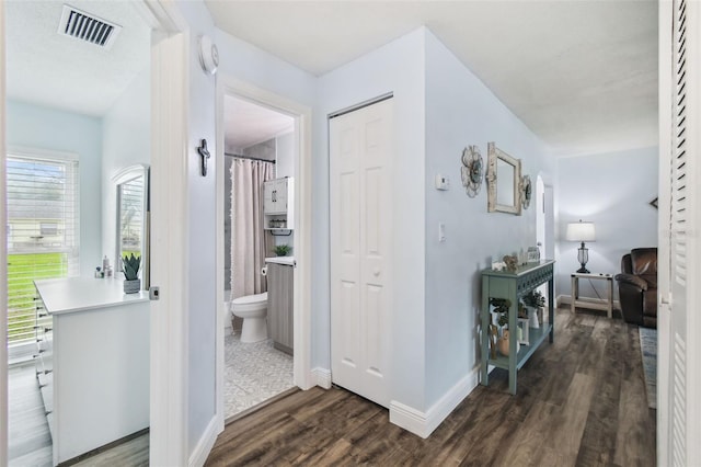 3628 Dellefield St, New Port Richey, FL 34655 - corridor with dark wood-type flooring and baseboards