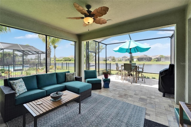 7116 Estero Ct, Apollo Beach, FL 33572 - sunroom / solarium featuring an outdoor hangout area, ceiling fan, outdoor dining area, and a water view