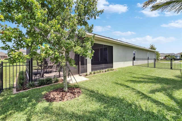 7116 Estero Ct, Apollo Beach, FL 33572 - back of property with a fenced backyard, stucco siding, and a sunroom