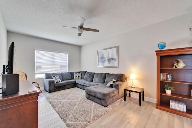 7116 Estero Ct, Apollo Beach, FL 33572 - living room with ceiling fan, light wood-type flooring, and a textured ceiling