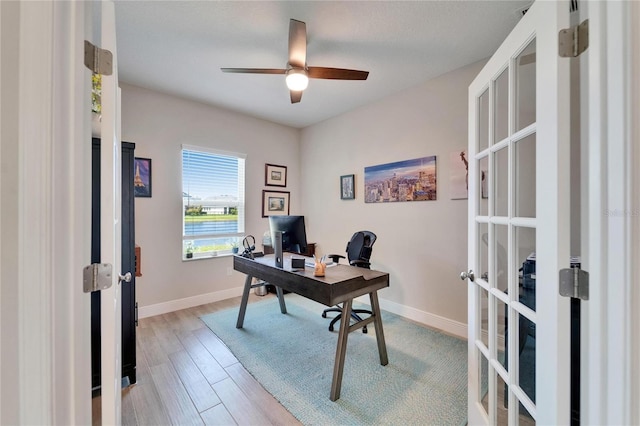 7116 Estero Ct, Apollo Beach, FL 33572 - home office featuring french doors, light wood finished floors, and a ceiling fan