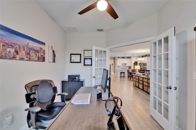 7116 Estero Ct, Apollo Beach, FL 33572 - office featuring french doors, a ceiling fan, light wood-style floors, and a chandelier