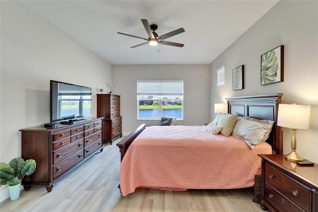 7116 Estero Ct, Apollo Beach, FL 33572 - bedroom featuring multiple windows, light wood-type flooring, and a ceiling fan