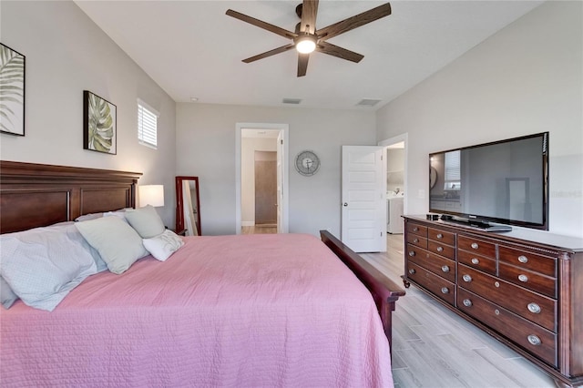 7116 Estero Ct, Apollo Beach, FL 33572 - bedroom with light wood-style floors, ceiling fan, ensuite bathroom, and washer / dryer