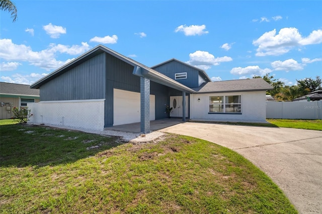 6841 Mitchell Cir, Tampa, FL 33634 - view of front of property with brick siding, an attached garage, and concrete driveway