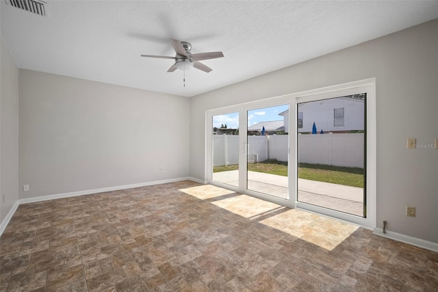 6841 Mitchell Cir, Tampa, FL 33634 - empty room with stone finish flooring and ceiling fan