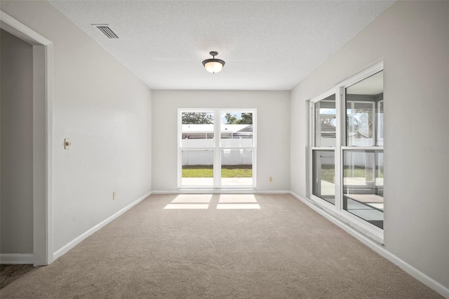 6841 Mitchell Cir, Tampa, FL 33634 - carpeted empty room featuring a textured ceiling