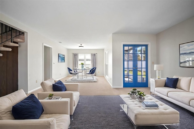 6841 Mitchell Cir, Tampa, FL 33634 - living room featuring french doors, carpet floors, and stairs