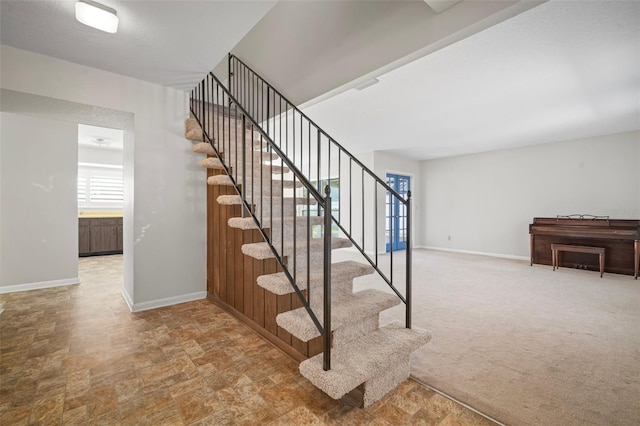 6841 Mitchell Cir, Tampa, FL 33634 - stairs featuring stone finish flooring and carpet floors